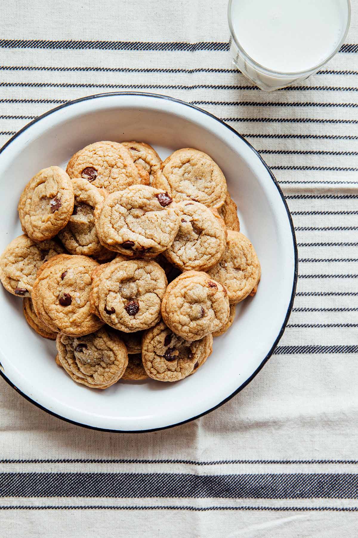A plate filled with brown butter chocolate chip cookies.