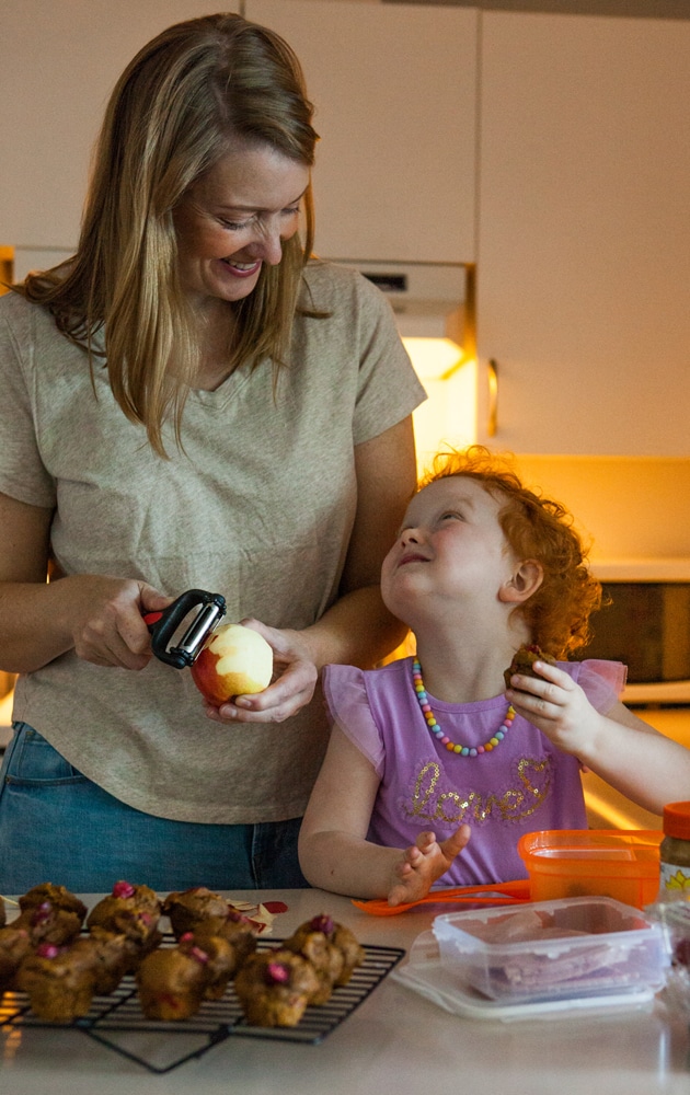 Nova Scotia food photographer Kelly Neil peeling an apple with her daughter Elodie.