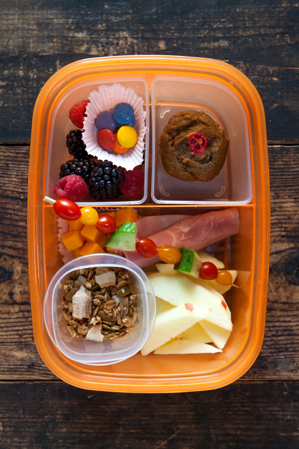 Overhead of plastic bento box lunch without lid.
