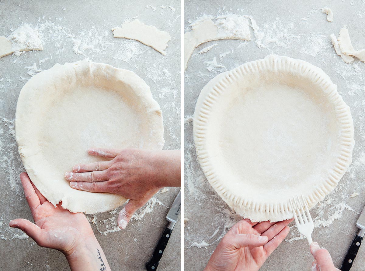 Hands pressing a crust intot a pie palte and crimping the edges with a fork.